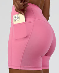 Woman wearing Fusion High-Rise 6" Short Pockets - Candy Pink | Model:Rosie | Size:S | Thumbnail Index: 1
