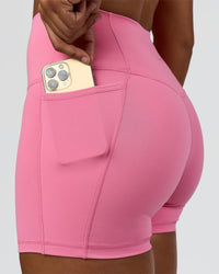 Woman wearing Fusion High-Rise 4" Short Pockets - Candy Pink | Model:Rosie | Size:S | Thumbnail Index: 2