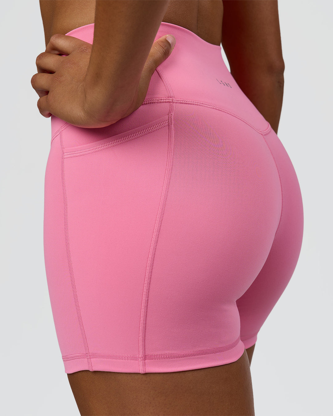 Woman wearing Fusion High-Rise 4" Short Pockets - Candy Pink | Model:Rosie | Size:S - view 7