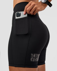 Woman wearing Fusion Hype Graphic Ultra High-Rise 6" Short Pockets - Black-Alloy | Model:Rhiley | Size:S | Thumbnail Index: 3