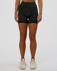 Woman wearing Fusion Icon Ultra High-Rise 6" Short Pockets - Energy Print Black | Model:Amity | Size:S | Thumbnail Index: 2
