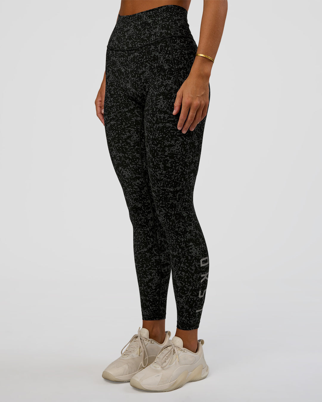 Woman wearing Fusion Icon Ultra High-Rise Full Length Legging Pockets - Energy Print Black-Reflective | Model:Amity | Size:S - view 1