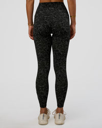 Woman wearing Fusion Icon Ultra High-Rise Full Length Legging Pockets - Energy Print Black-Reflective | Model:Amity | Size:S | Thumbnail Index: 3
