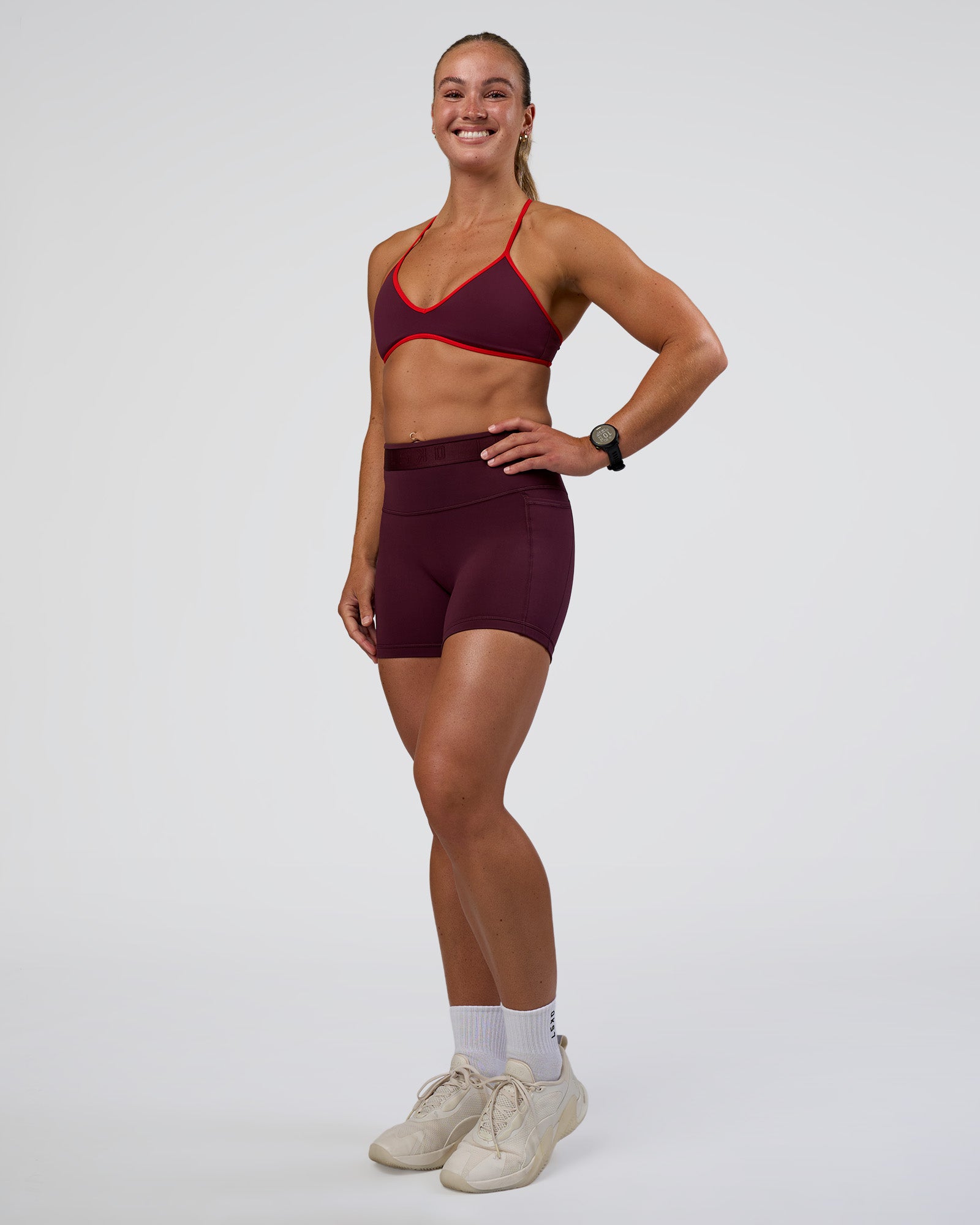 Woman wearing Fusion Jacquard High-Rise 4” Short Pockets - Cherry Lacquer | Model:Sav | Size:S