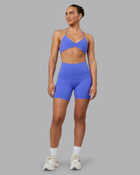 Woman wearing Fusion Ultra High-Rise 6" Short Pockets - Baja Blue | Model:Sophie | Size:S | Thumbnail Index: 1