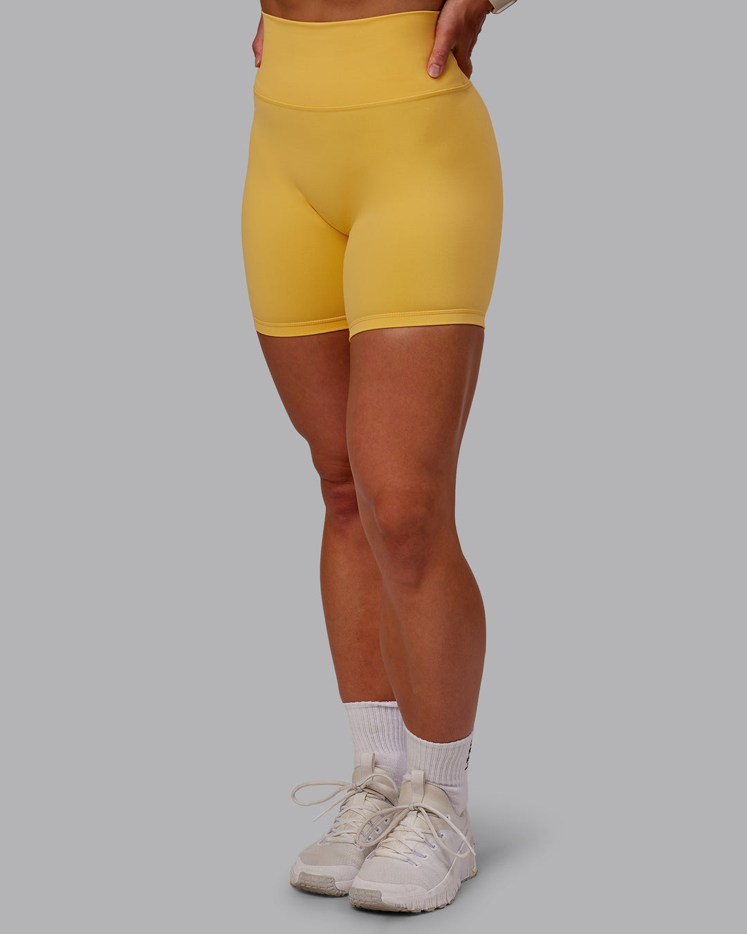 Woman wearing Fusion Ultra High-Rise 6" Short - Banana Cream | Model:Amber | Size:S - view 9