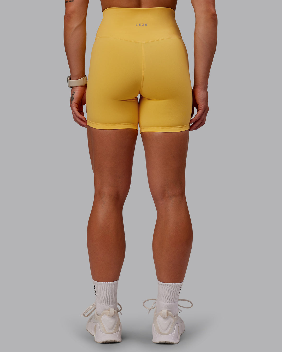 Woman wearing Fusion Ultra High-Rise 6" Short - Banana Cream | Model:Amber | Size:S - view 7