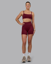 Woman wearing Fusion Ultra High-Rise 6" Short Pockets - Cordovan | Model:Chloe | Size:XS | Thumbnail Index: 0