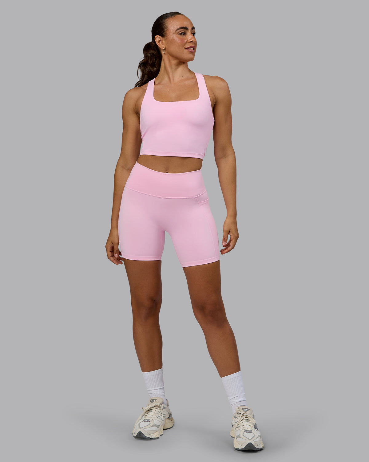 Woman wearing Fusion Ultra High-Rise 6" Short Pockets - Pale Pink | Model:Sophie | Size:S