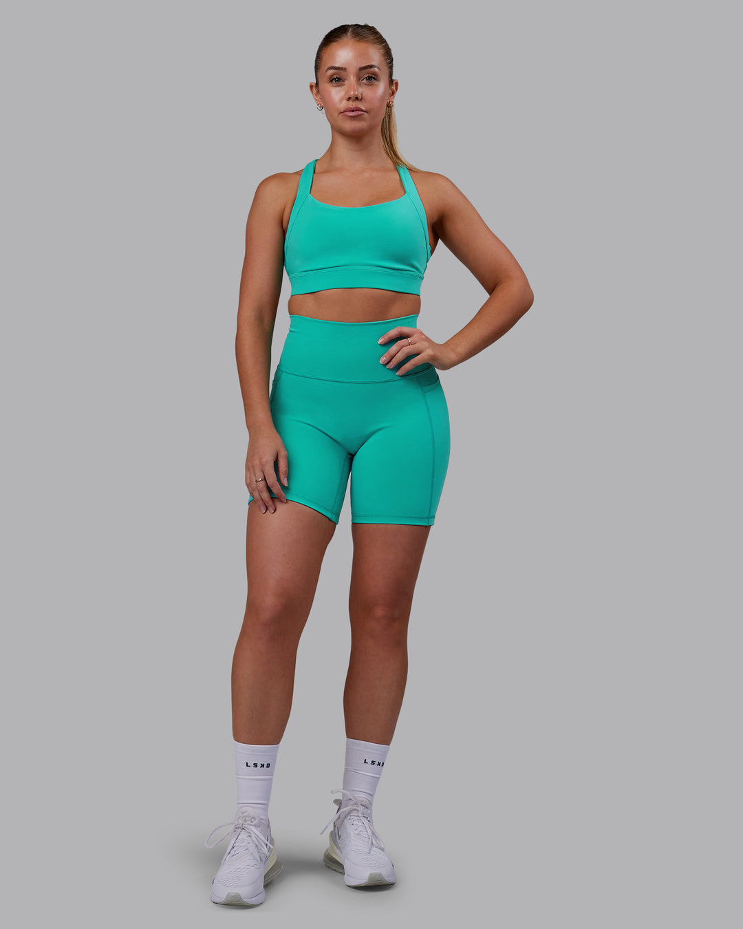 Woman wearing Fusion Ultra High-Rise 6" Short Pockets - Turquoise Tide | Model:Hannah | Size:S - view 6