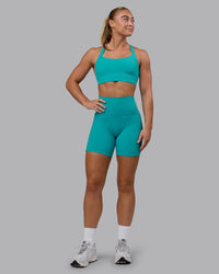 Woman wearing Fusion Ultra High-Rise 6" Short Pockets - Uplift Blue | Model:Monique | Size:S | Thumbnail Index: 5
