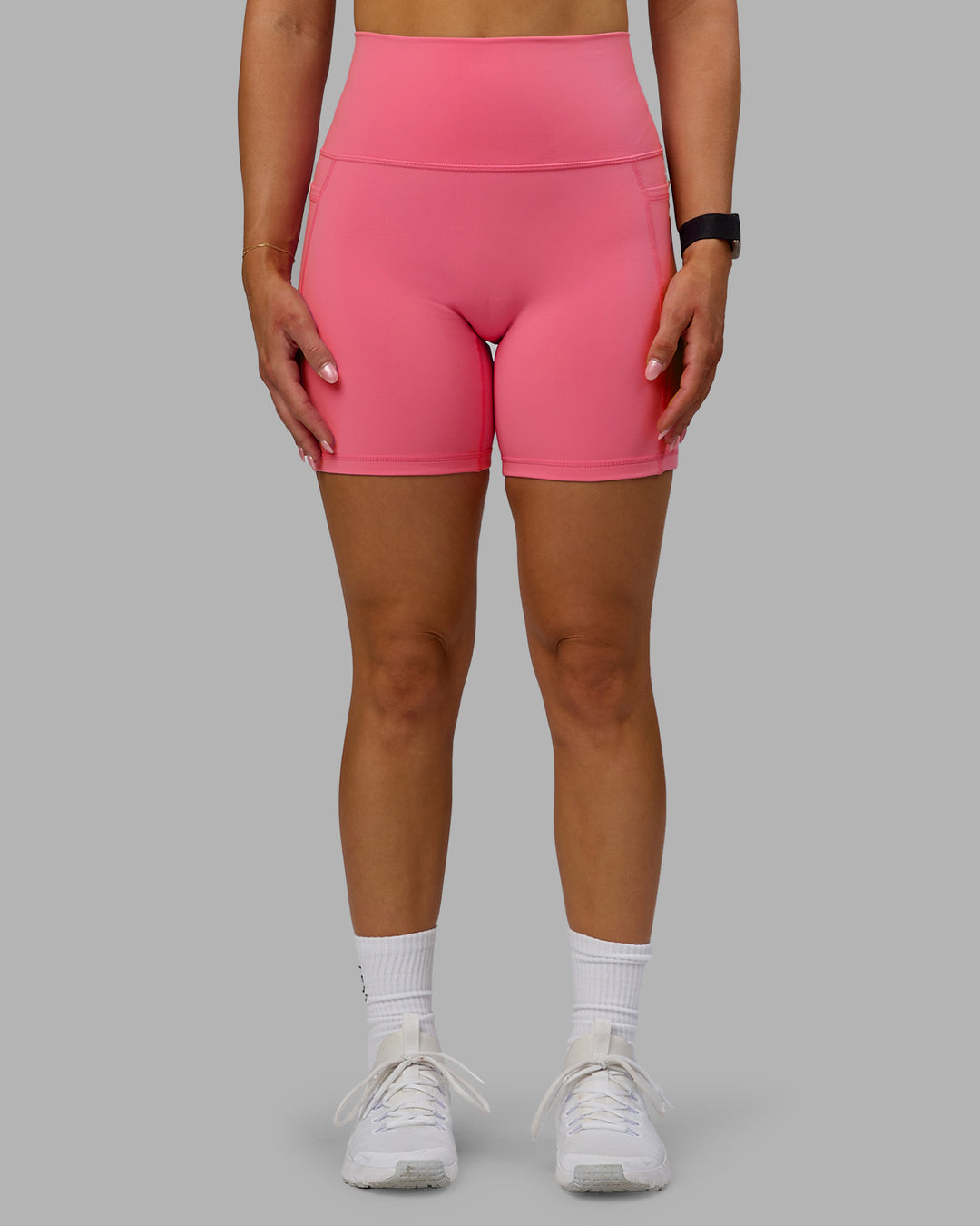 Woman wearing Fusion Ultra High-Rise 6" Short Pockets - Pink Lemonade | Model:Halle | Size:S - view 1