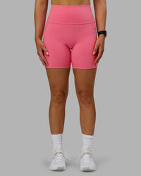 Woman wearing Fusion Ultra High-Rise 6" Short Pockets - Pink Lemonade | Model:Halle | Size:S | Thumbnail Index: 0