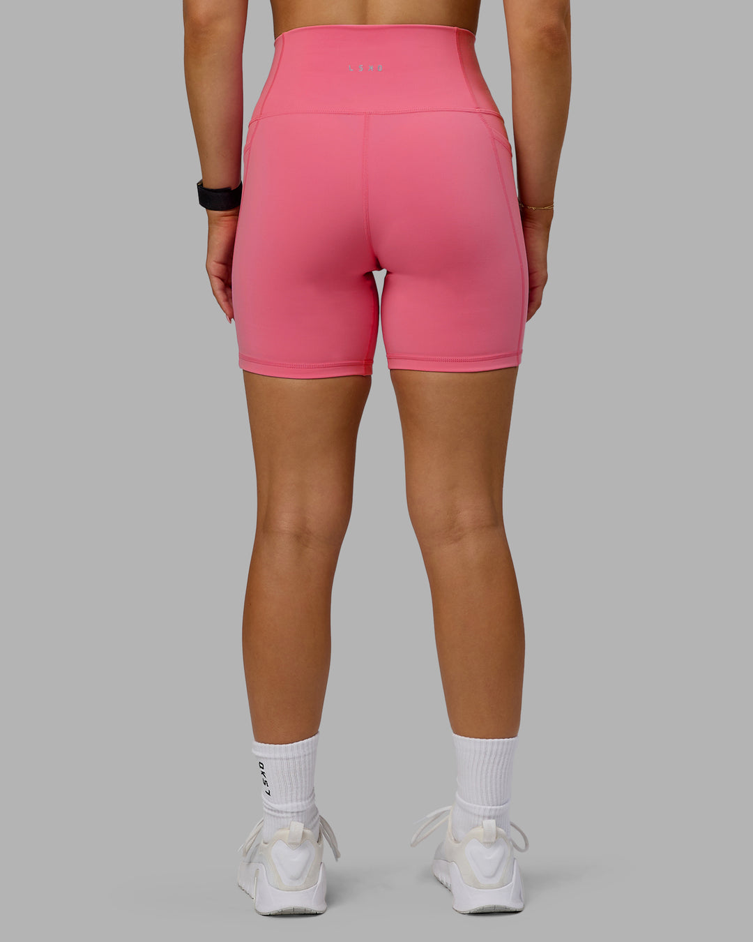 Woman wearing Fusion Ultra High-Rise 6" Short Pockets - Pink Lemonade | Model:Halle | Size:S - view 3