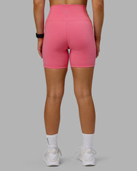 Woman wearing Fusion Ultra High-Rise 6" Short Pockets - Pink Lemonade | Model:Halle | Size:S | Thumbnail Index: 2