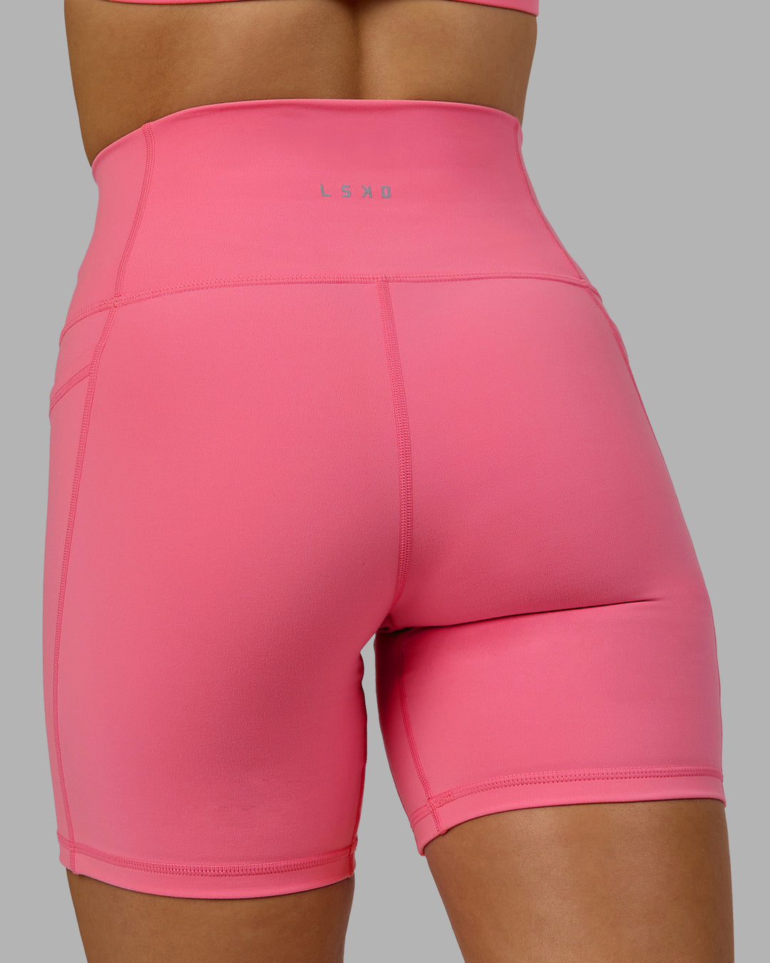 Woman wearing Fusion Ultra High-Rise 6" Short Pockets - Pink Lemonade | Model:Halle | Size:S - view 6