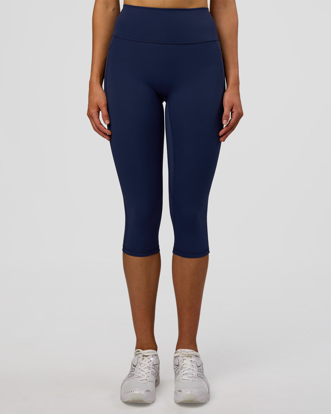 Woman wearing Fusion Ultra High-Rise 3/4 Legging Pockets - Future Navy | Model:Evie | Size:S - view 6