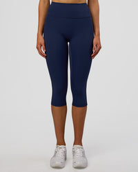 Woman wearing Fusion Ultra High-Rise 3/4 Legging Pockets - Future Navy | Model:Evie | Size:S | Thumbnail Index: 5