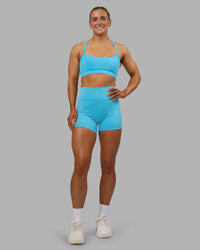 Woman wearing Fusion Ultra High-Rise 4" Short - Blue Atoll | Model:Georgia | Size:S | Thumbnail Index: 7