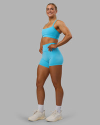 Woman wearing Fusion Ultra High-Rise 4" Short - Blue Atoll | Model:Georgia | Size:S | Thumbnail Index: 3