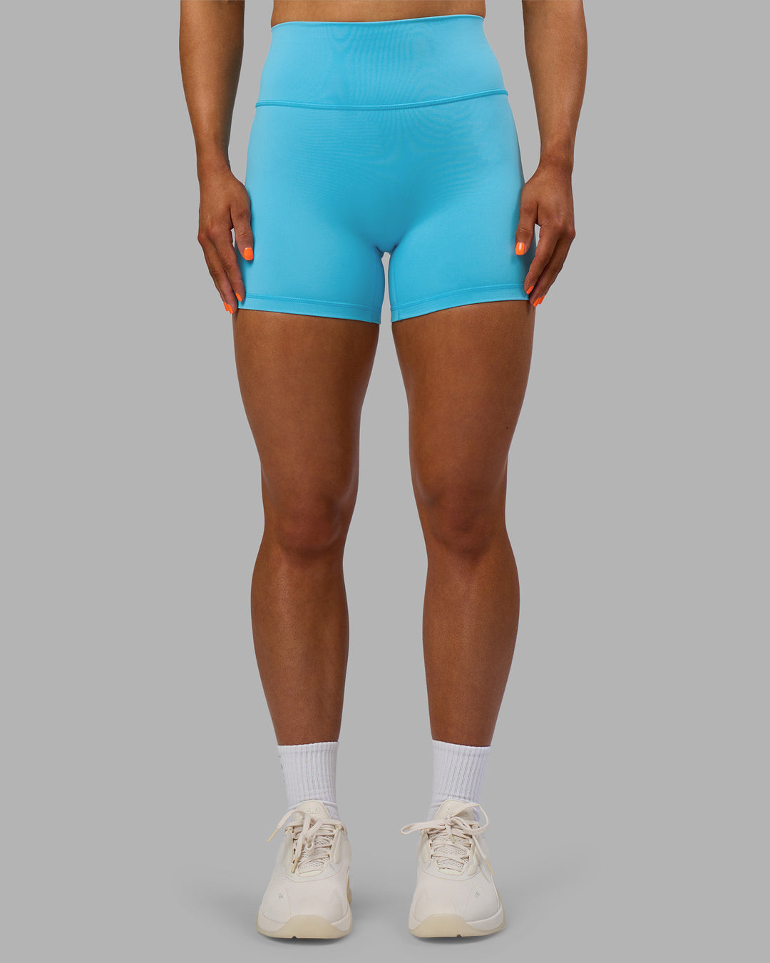Woman wearing Fusion Ultra High-Rise 4" Short - Blue Atoll | Set:true | Angle:front | Model:Georgia | Size:S - view 1
