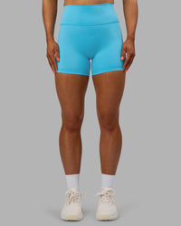 Woman wearing Fusion Ultra High-Rise 4" Short - Blue Atoll | Set:true | Angle:front | Model:Georgia | Size:S | Thumbnail Index: 0