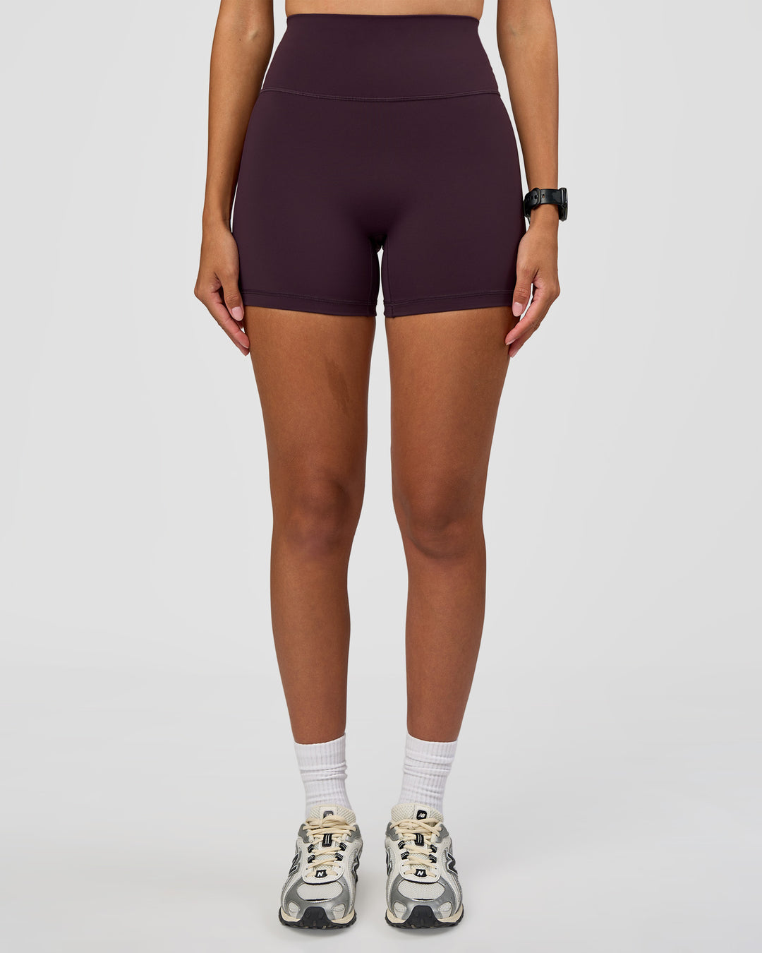 Woman wearing Fusion Ultra High-Rise 4" Short - Midnight Plum | Set:true | Angle:front | Model:Rhiley | Size:S - view 3