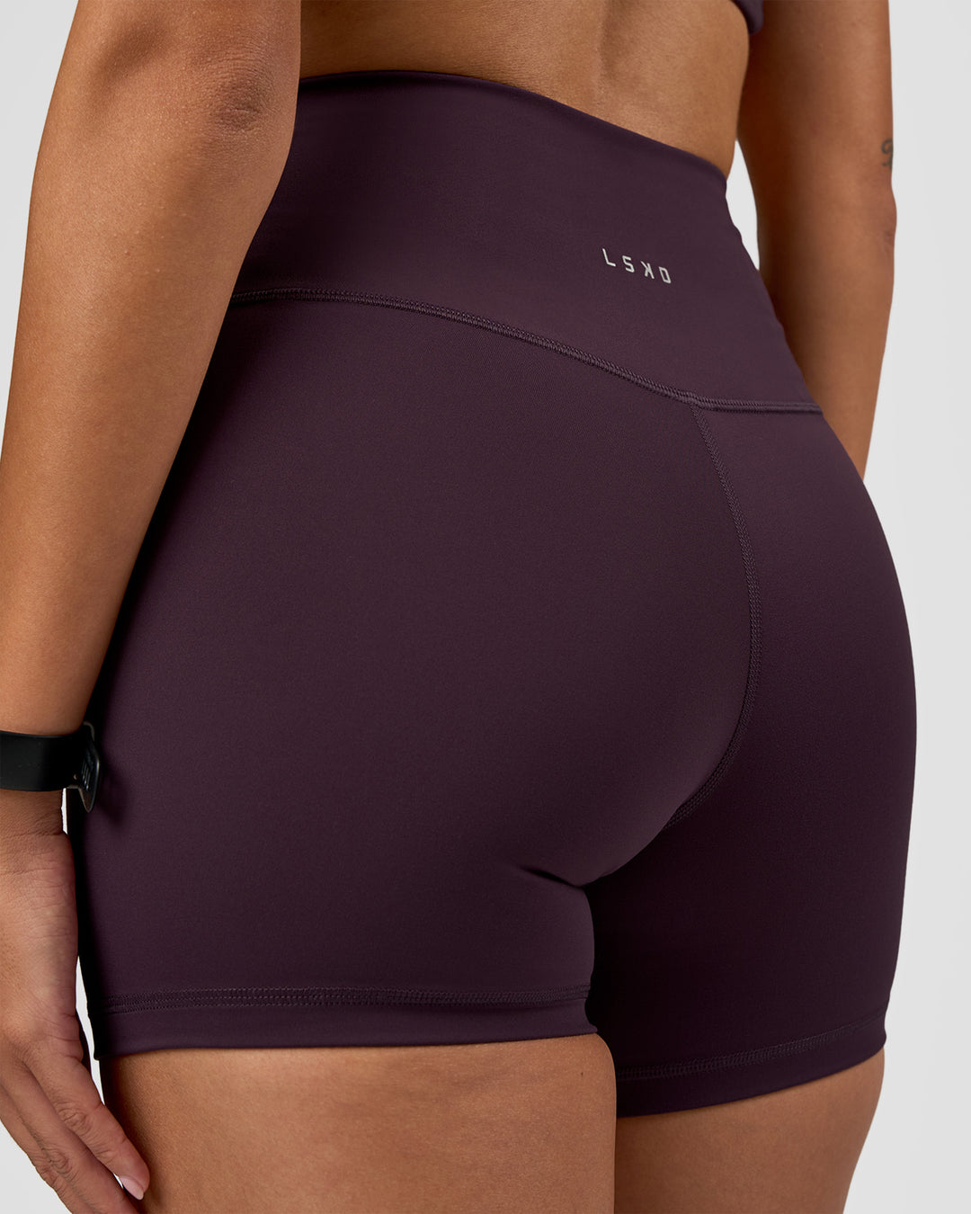 Woman wearing Fusion Ultra High-Rise 4" Short - Midnight Plum | Model:Rhiley | Size:S - view 6