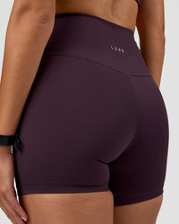 Woman wearing Fusion Ultra High-Rise 4" Short - Midnight Plum | Model:Rhiley | Size:S | Thumbnail Index: 5