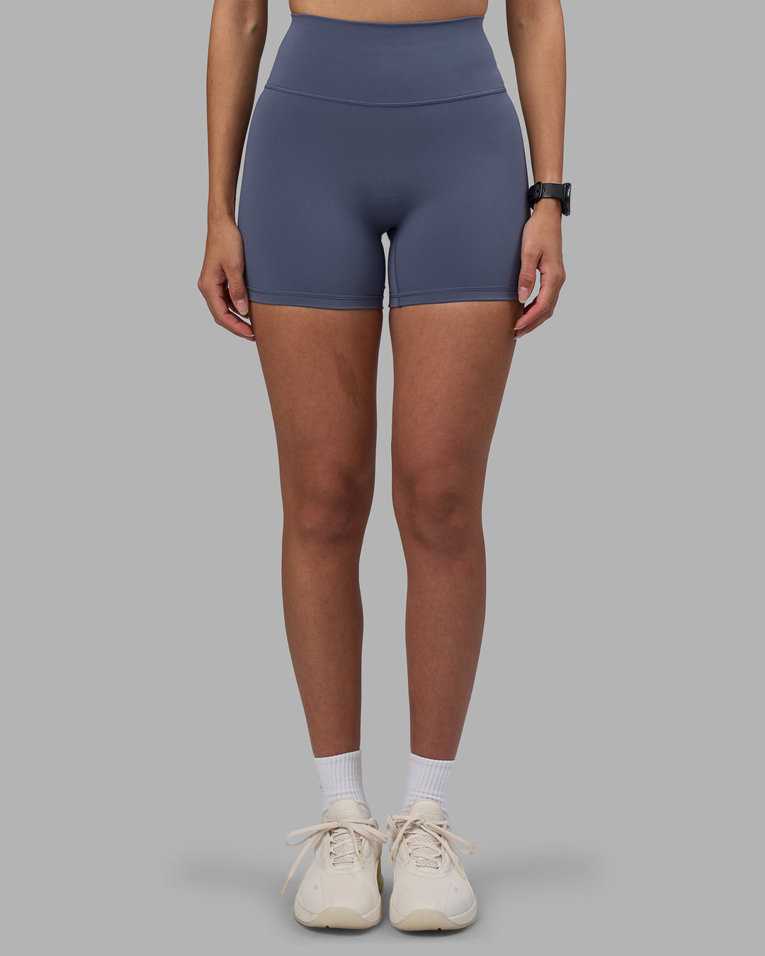 Woman wearing Fusion Ultra High-Rise 4" Short - Night Shadow | Set:true | Angle:front | Model:Rhiley | Size:S - view 7