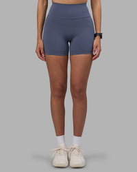 Woman wearing Fusion Ultra High-Rise 4" Short - Night Shadow | Set:true | Angle:front | Model:Rhiley | Size:S | Thumbnail Index: 6