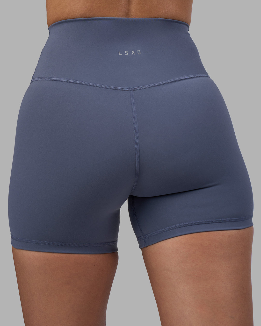 Woman wearing Fusion Ultra High-Rise 4" Short - Night Shadow | Model:Rhiley | Size:S - view 8