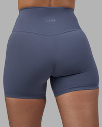 Woman wearing Fusion Ultra High-Rise 4" Short - Night Shadow | Model:Rhiley | Size:S | Thumbnail Index: 7