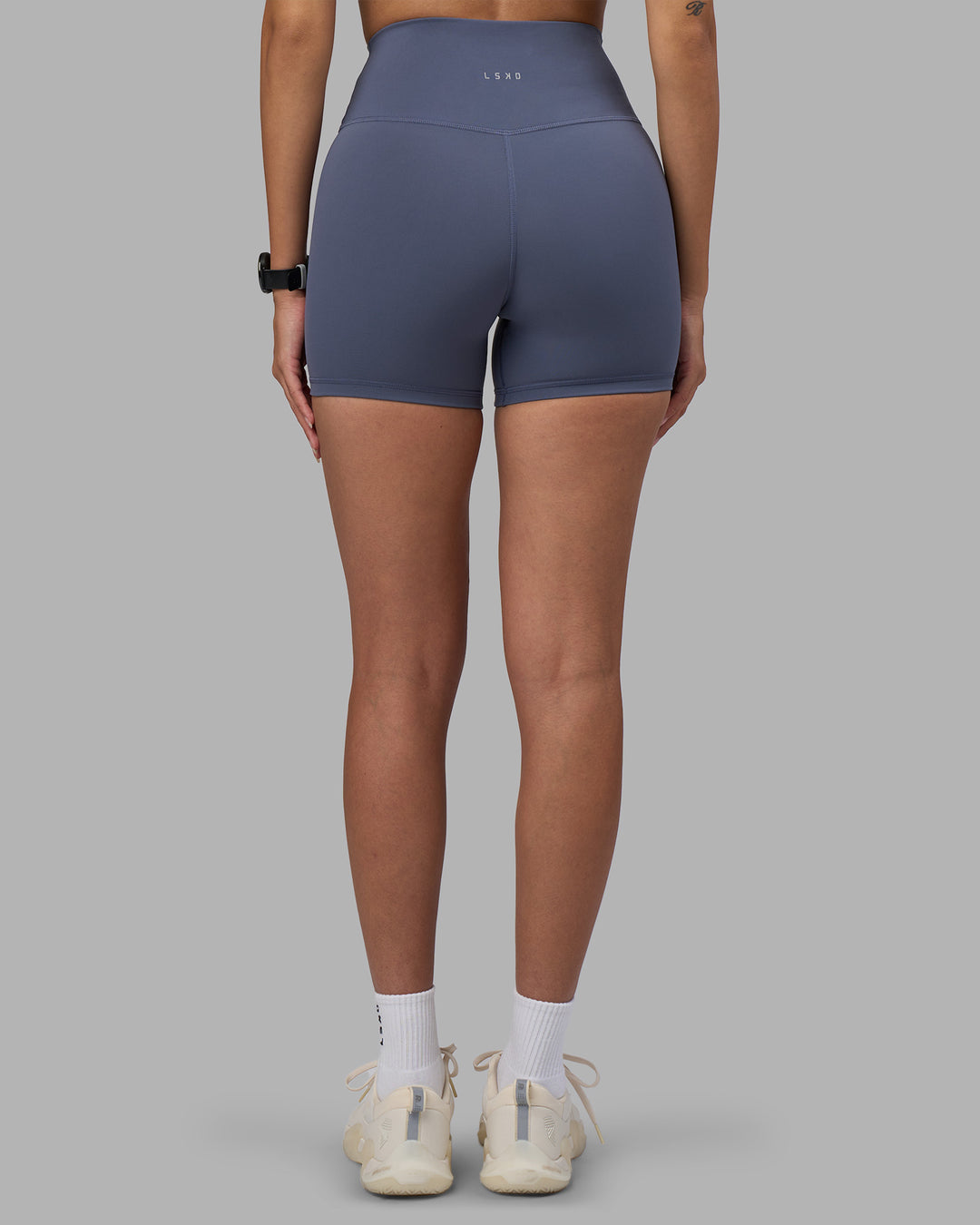 Woman wearing Fusion Ultra High-Rise 4" Short - Night Shadow | Set:true | Angle:back | Model:Rhiley | Size:S - view 4