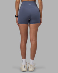 Woman wearing Fusion Ultra High-Rise 4" Short - Night Shadow | Set:true | Angle:back | Model:Rhiley | Size:S | Thumbnail Index: 3