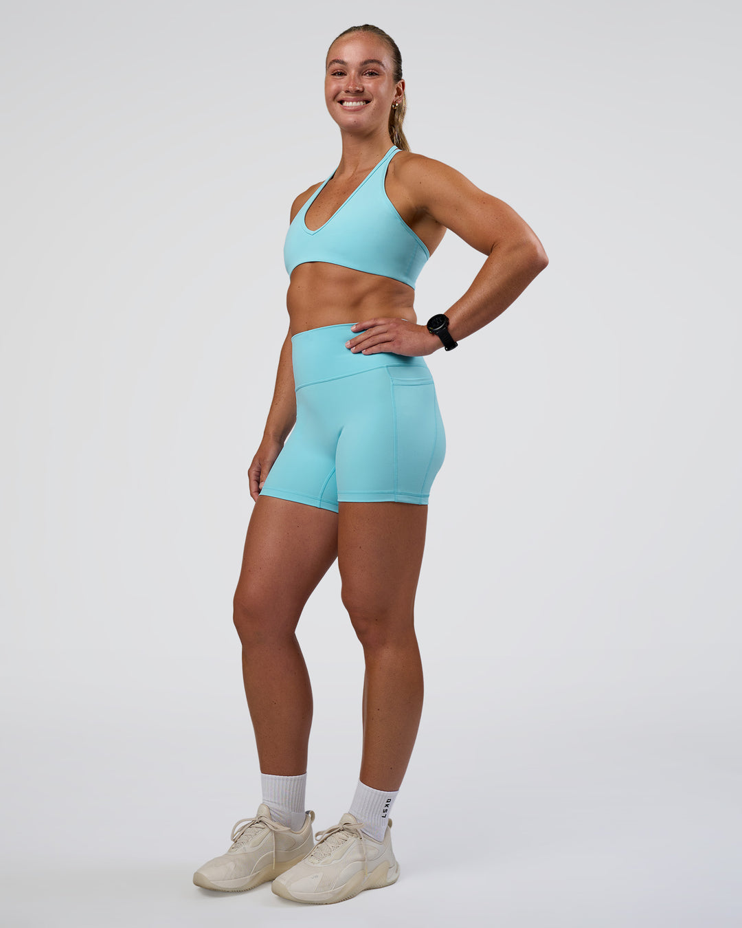 Woman wearing Fusion Ultra High-Rise 4" Short Pockets - Baltic Sea | Model:Sav | Size:S - view 5