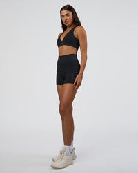Woman wearing Fusion Ultra High-Rise 4" Short Pockets - Black | Model:Ruby | Size:S | Thumbnail Index: 4