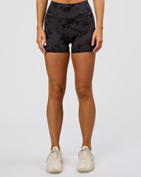 Woman wearing Fusion Ultra High-Rise 4" Short Pockets - Black Tie Dye | Set:true | Angle:front | Model:Amity | Size:S | Thumbnail Index: 1
