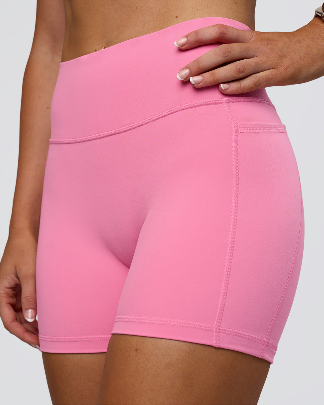 Woman wearing Fusion Ultra High-Rise 4" Short Pockets - Candy Pink | Model:Emelia | Size:S - view 5