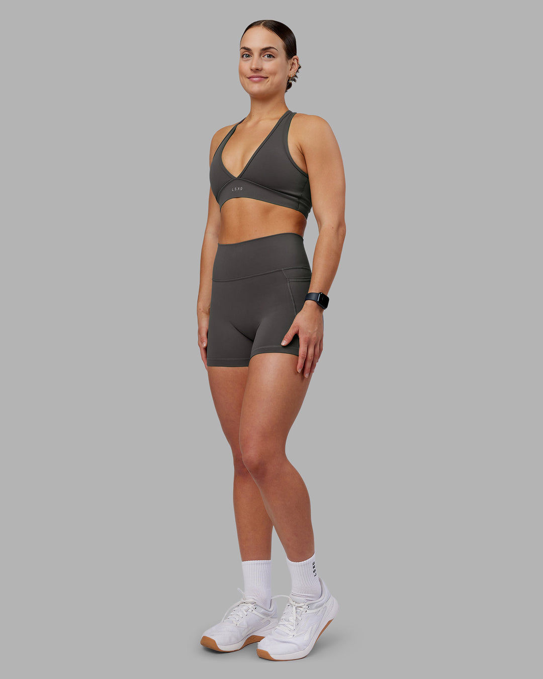 Woman wearing Fusion Ultra High-Rise 4" Short Pockets - Dark Storm | Model:Keisha | Size:S - view 2