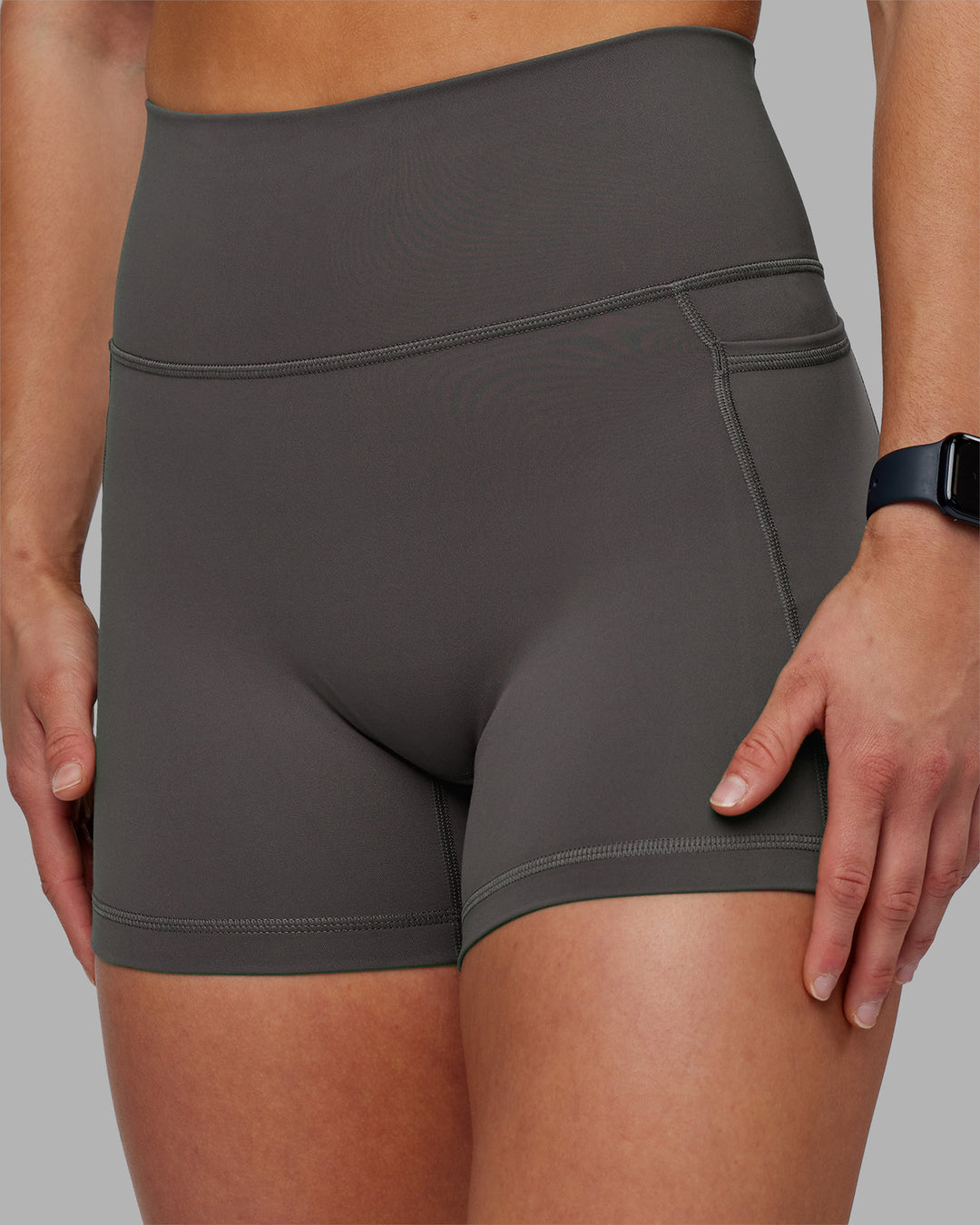 Woman wearing Fusion Ultra High-Rise 4" Short Pockets - Dark Storm | Model:Keisha | Size:S - view 10
