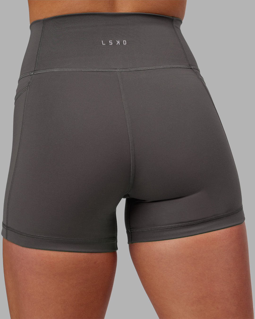 Woman wearing Fusion Ultra High-Rise 4" Short Pockets - Dark Storm | Model:Keisha | Size:S - view 9