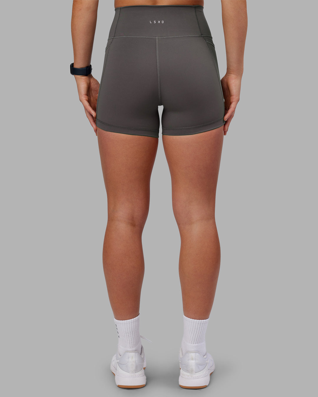 Woman wearing Fusion Ultra High-Rise 4" Short Pockets - Dark Storm | Model:Keisha | Size:S - view 6