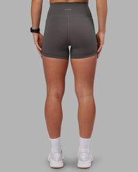 Woman wearing Fusion Ultra High-Rise 4" Short Pockets - Dark Storm | Model:Keisha | Size:S | Thumbnail Index: 5
