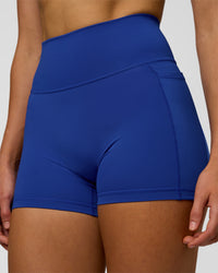Woman wearing Fusion Ultra High-Rise 4" Short Pockets - Electric Indigo | Model:Evie | Size:S | Thumbnail Index: 6