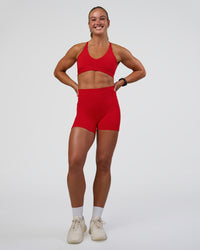 Woman wearing Fusion Ultra High-Rise 4" Short Pockets - Flame | Model:Sav | Size:S | Thumbnail Index: 1