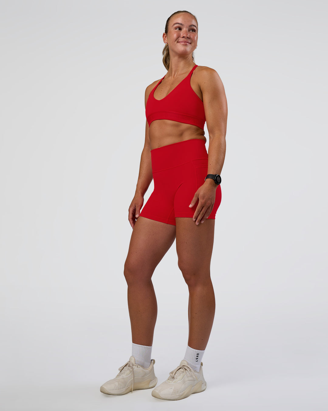 Woman wearing Fusion Ultra High-Rise 4" Short Pockets - Flame | Model:Sav | Size:S - view 5