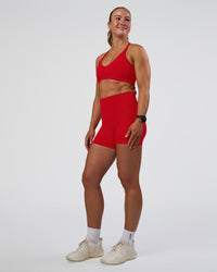 Woman wearing Fusion Ultra High-Rise 4" Short Pockets - Flame | Model:Sav | Size:S | Thumbnail Index: 4