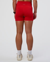Woman wearing Fusion Ultra High-Rise 4" Short Pockets - Flame | Set:true | Angle:back | Model:Sav | Size:S | Thumbnail Index: 3