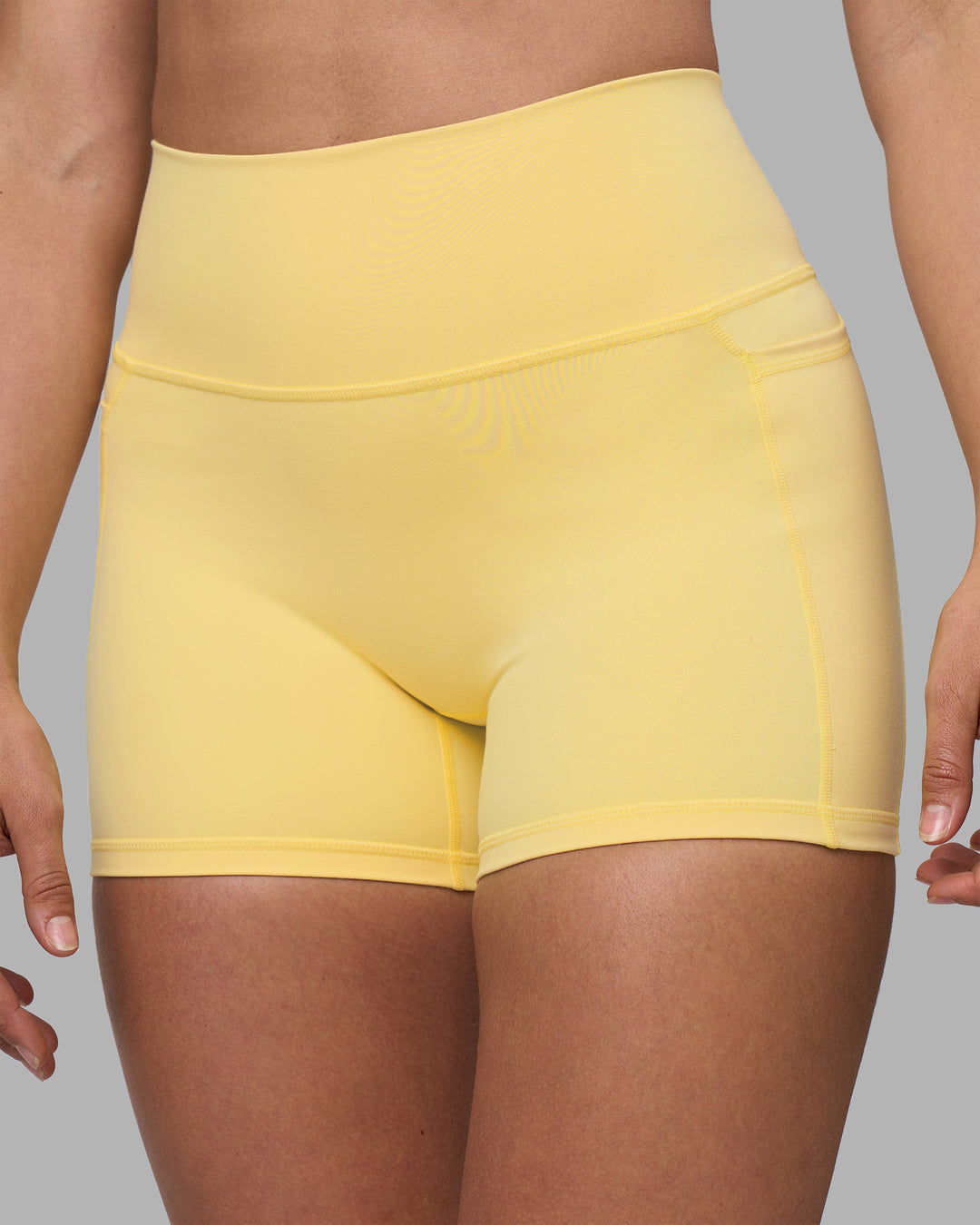 Woman wearing Fusion Ultra High-Rise 4" Short Pockets - Lemon | Model:Sophie | Size:S - view 6